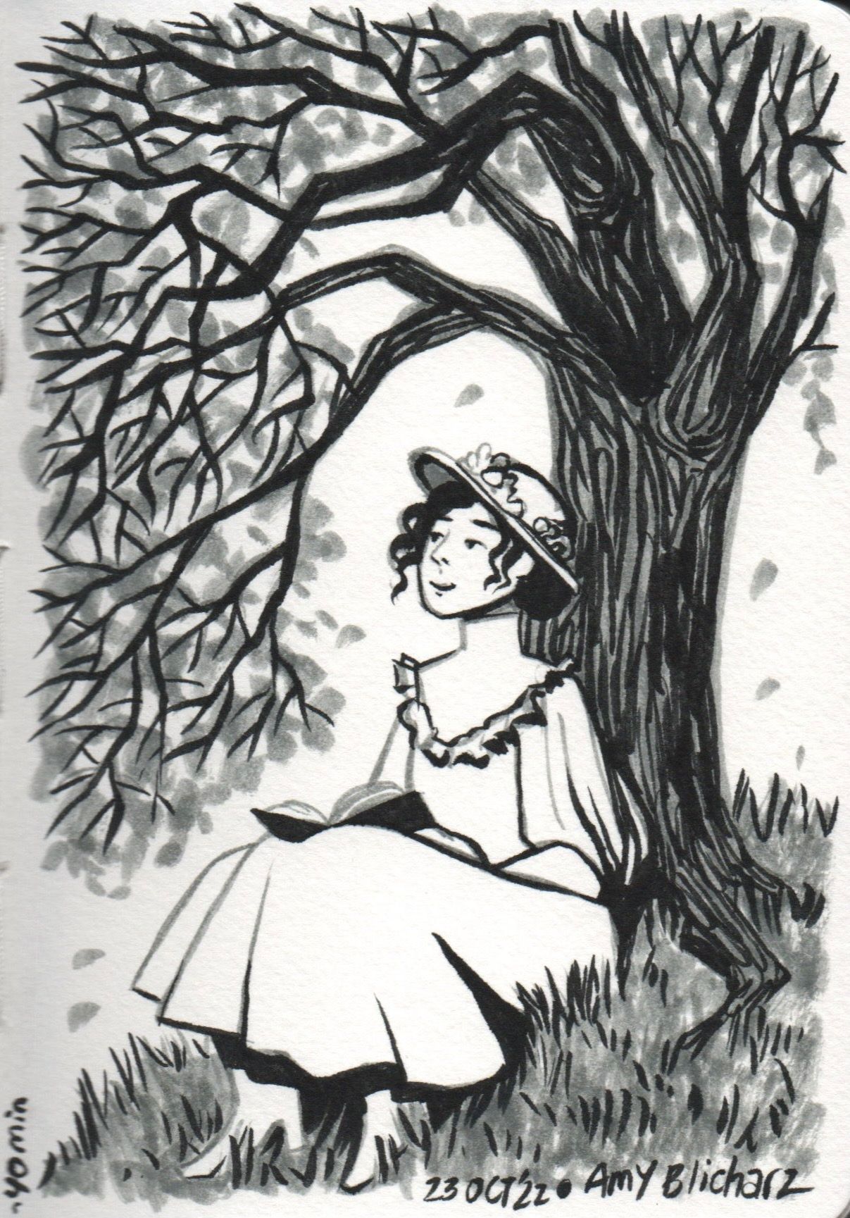 A young woman in an old-fashioned dress and hat sits under a tree with a book in her lap